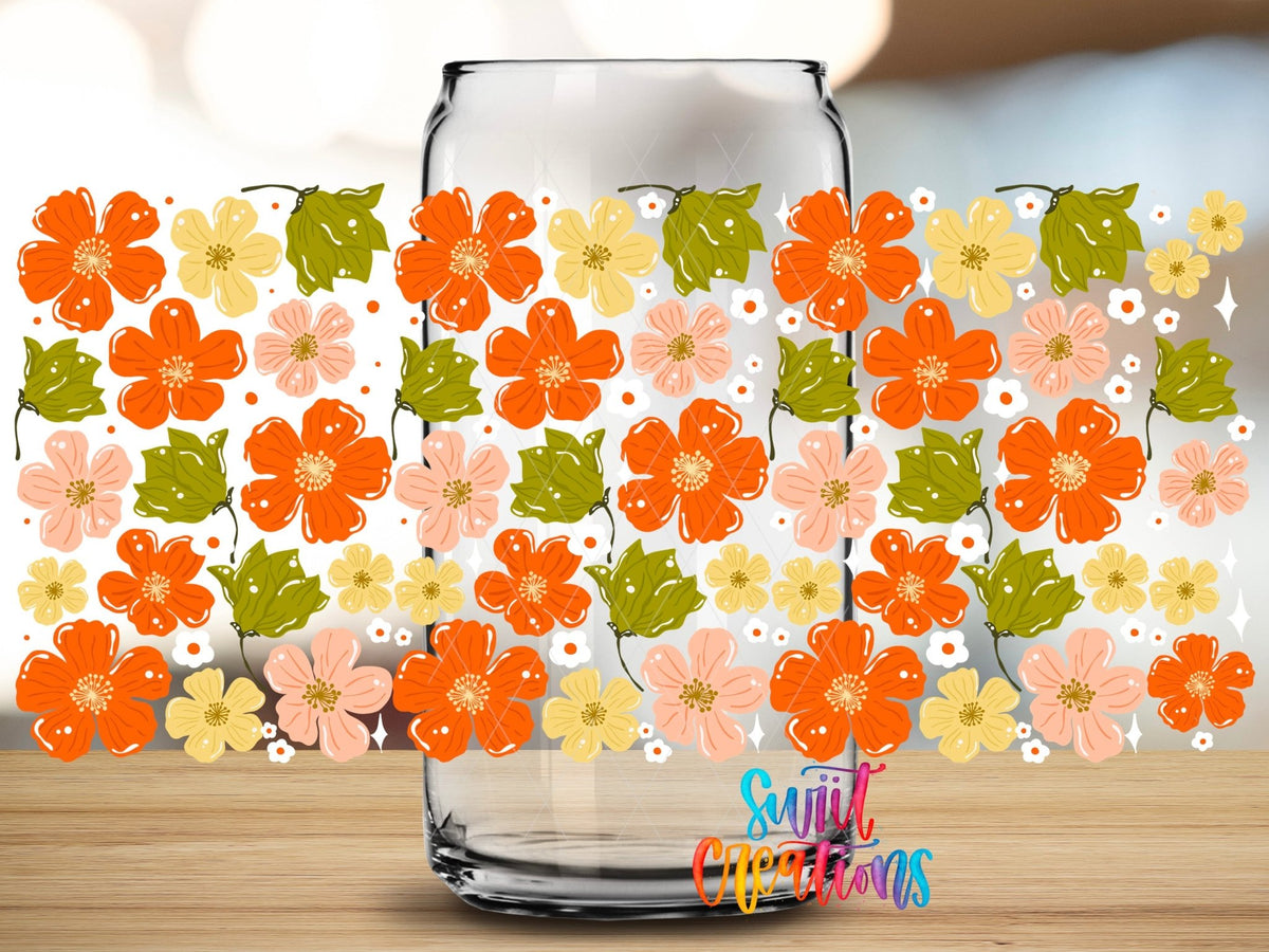 Close-up of the Cozy Fall Flowers UV DTF full wrap on a clear glass can