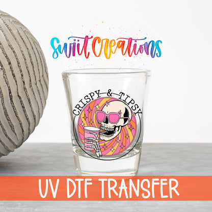 Crispy and Tipsy UV DTF transfer on a clear shot glass with the Swiit Creations logo and UV DTF Transfer banner