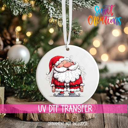 Curly Beard Santa ornament UV DTF transfer on an ornament resting on a wood slice beside a Christmas tree