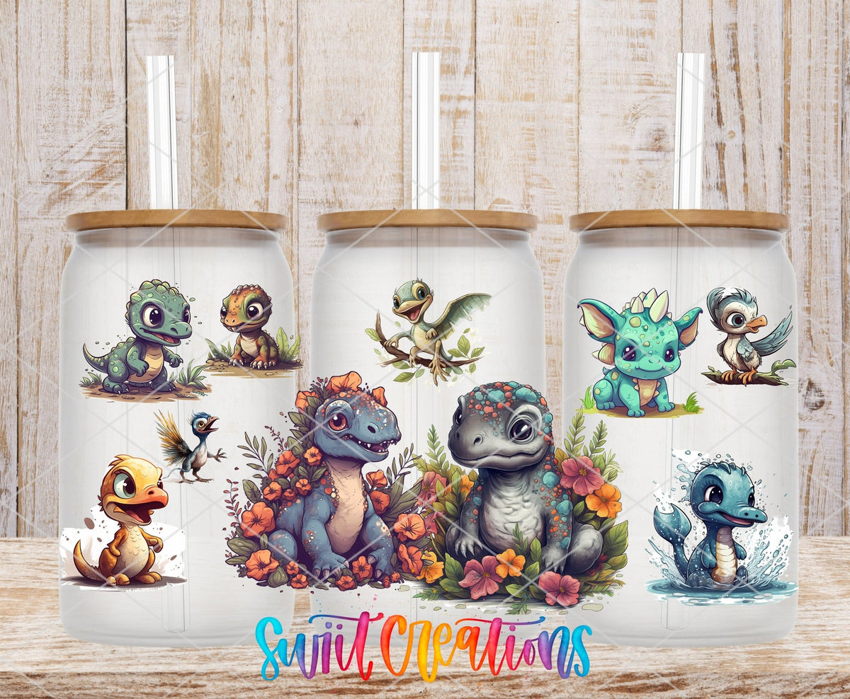 Cute Baby Dinosaurs UV DTF wrap on three clear glass cans with bamboo lids