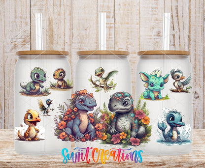 Cute Baby Dinosaurs UV DTF wrap on three clear glass cans with bamboo lids