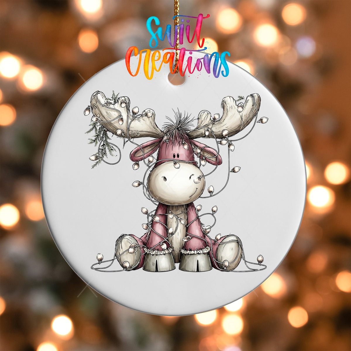 Close-up of the Pink Moose with Lights UV DTF transfer on a round white ornament
