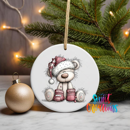 Pink Winter Bear ornament UV DTF transfer on a hanging ornament with pine branches and a gold bauble
