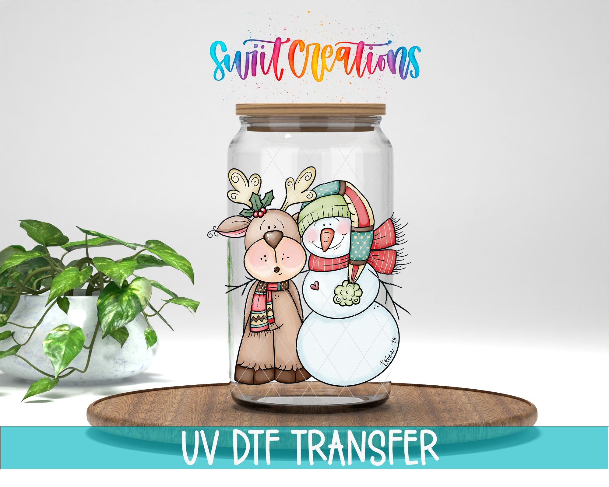 Swiit Creations Reindeer and Snowman Christmas UV DTF transfer on a clear glass jar mockup