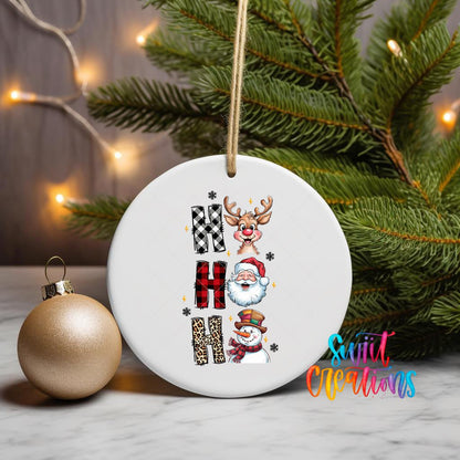 Ho Ho Ho Characters ornament UV DTF transfer on a hanging ornament with pine branches and a gold bauble