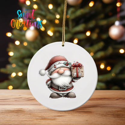 Santa with Gift ornament UV DTF transfer on an ornament on a wooden table with tree lights behind it