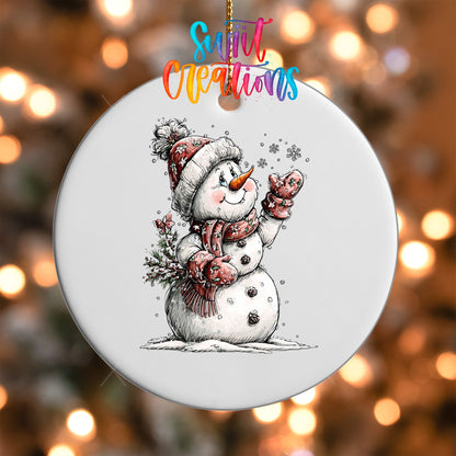 Close-up of the Snowman with Snowflakes UV DTF transfer on a round white ornament