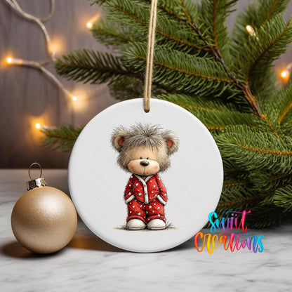 Teddy Bear in Red Pajamas ornament UV DTF transfer on a hanging ornament with pine branches and a gold bauble