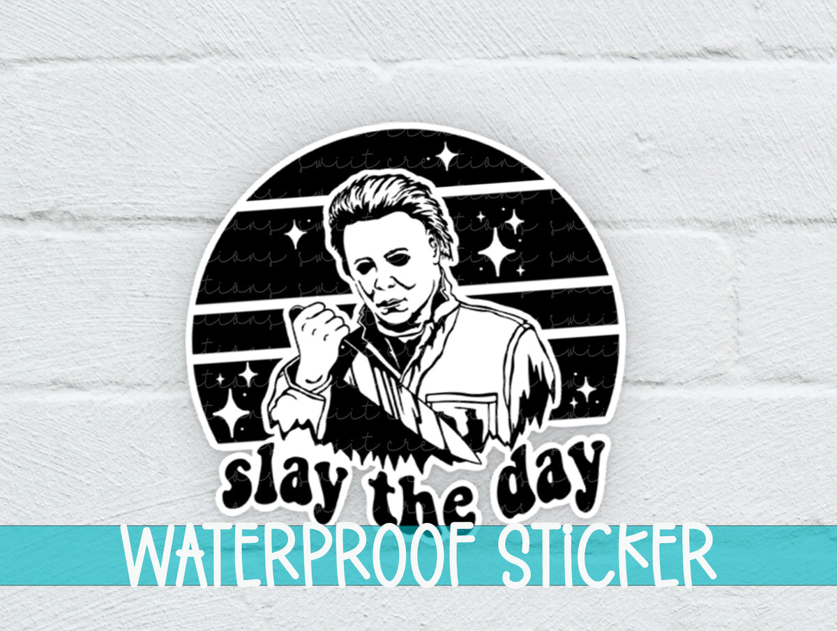 Slay the Day sticker on a white brick background with a waterproof sticker banner