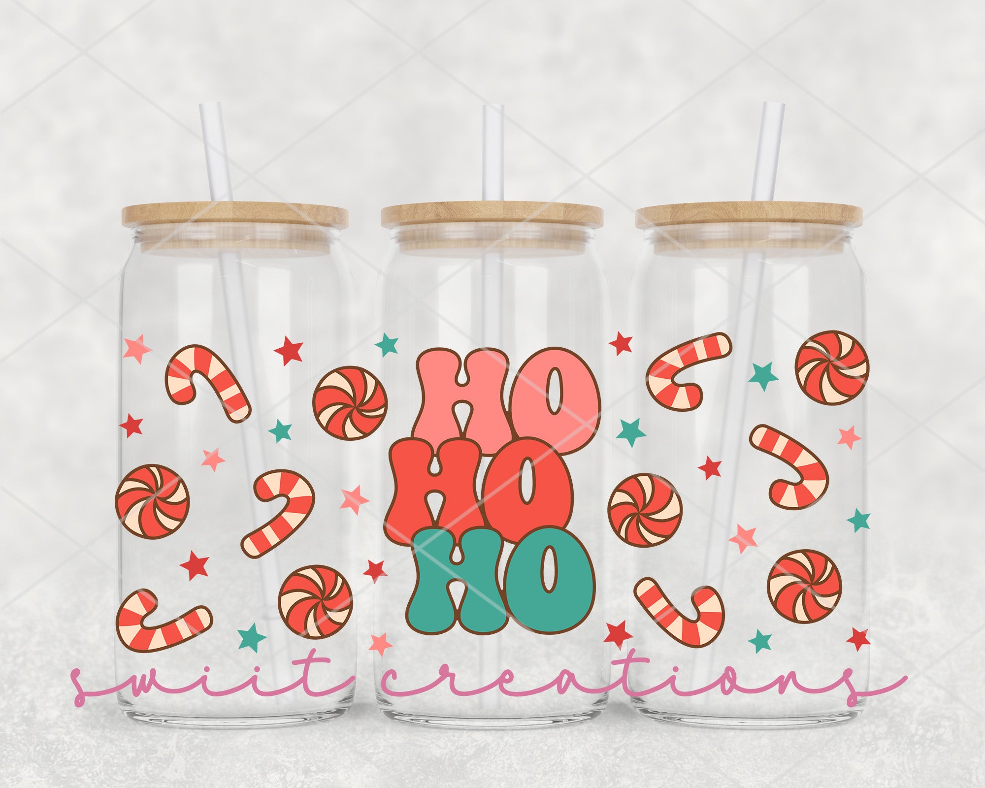 three glass tumblers with candy canes on them
