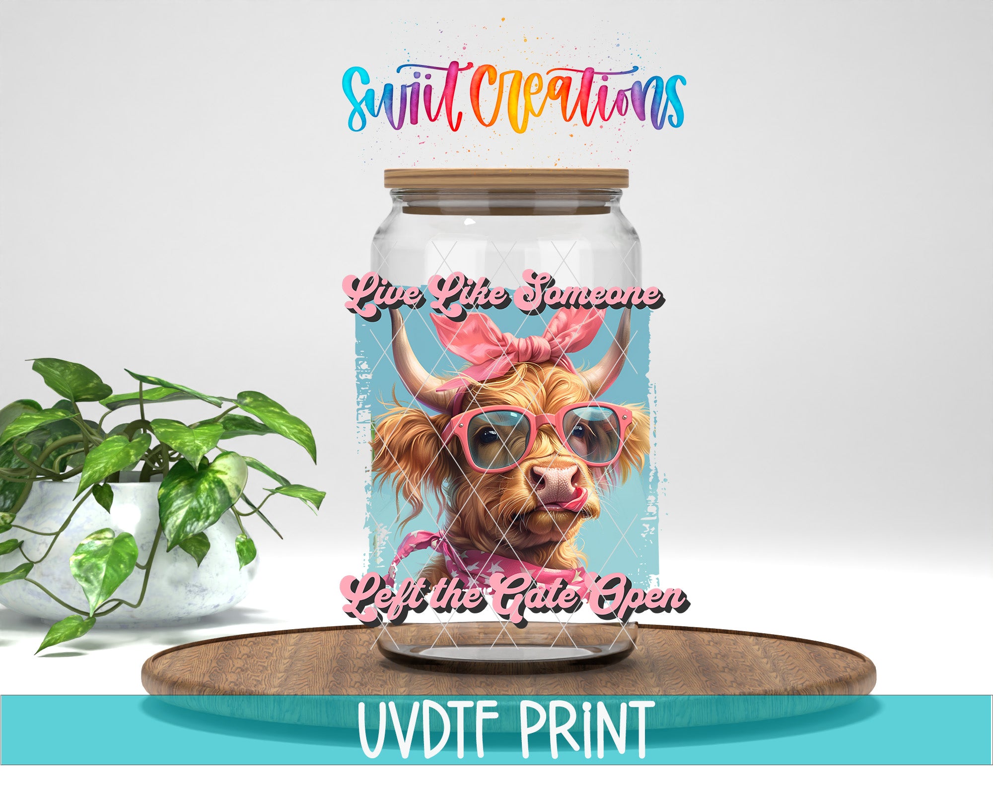 A glass jar with a cow wearing sunglasses and a pink bow, along with the text "Live Like Someone Left the Gate Open" and "Swift Creations" printed on it.