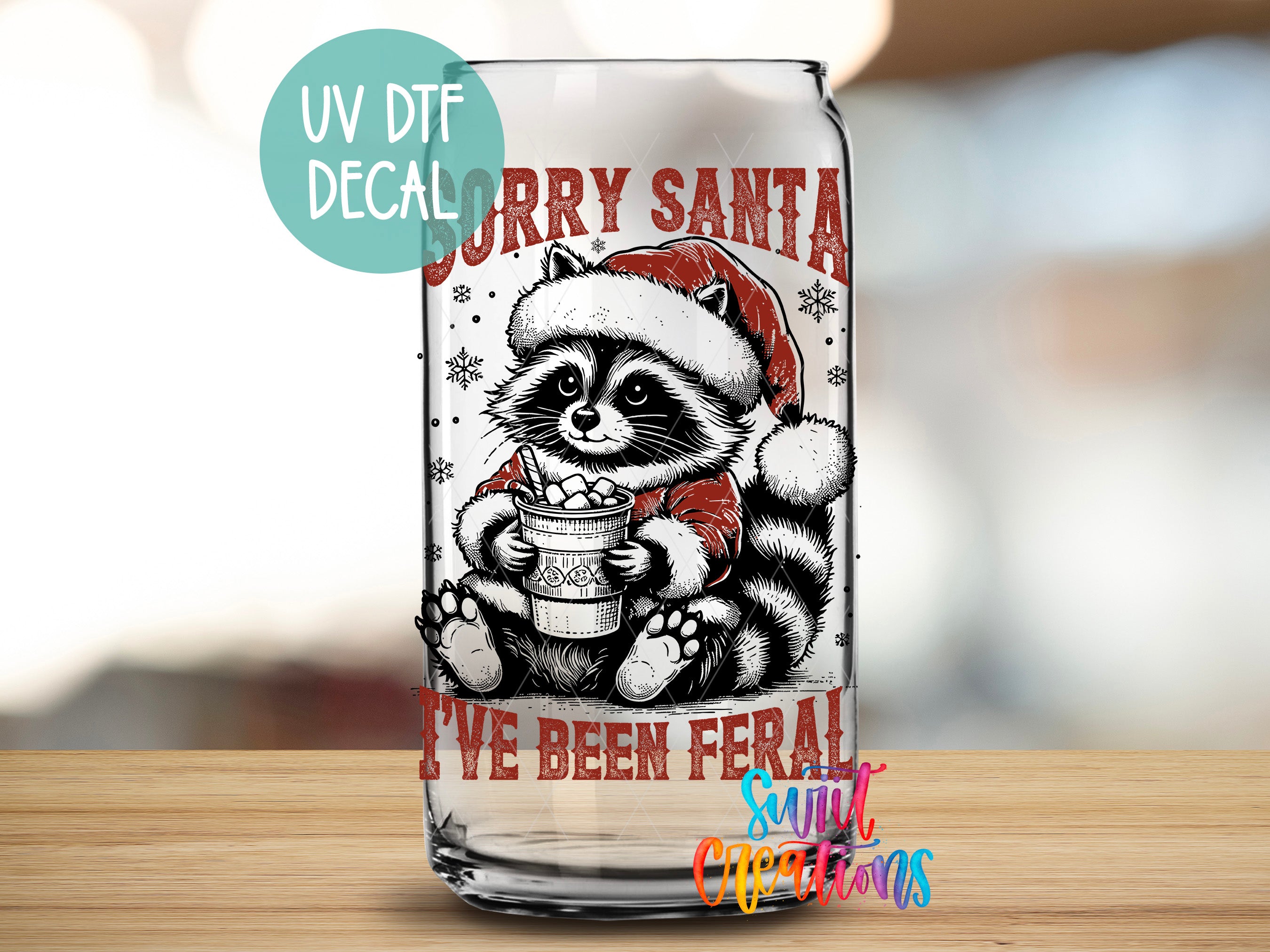 a glass with a picture of a raccoon wearing a santa hat