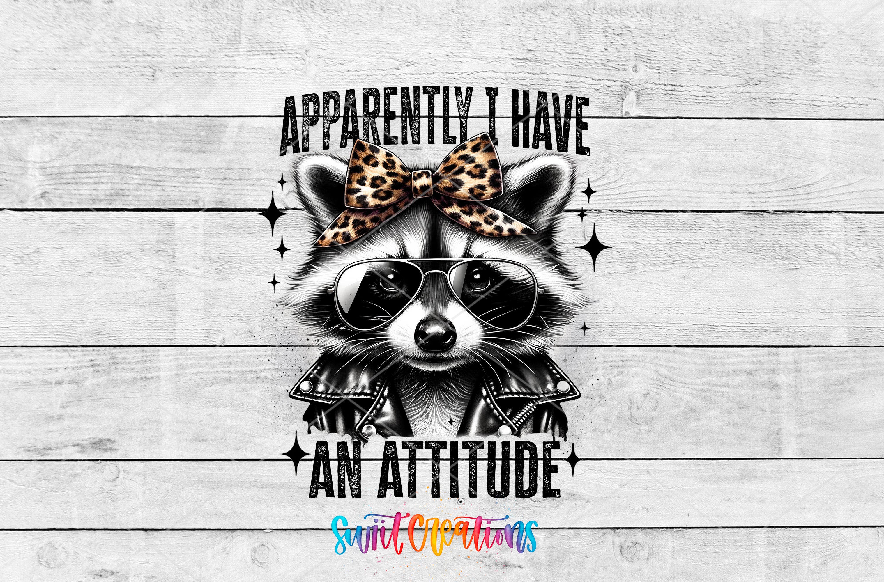 A raccoon wearing sunglasses and a leopard print bow tie, with the text "Approximately I have an attitude" and "Spirit Creations" below it.