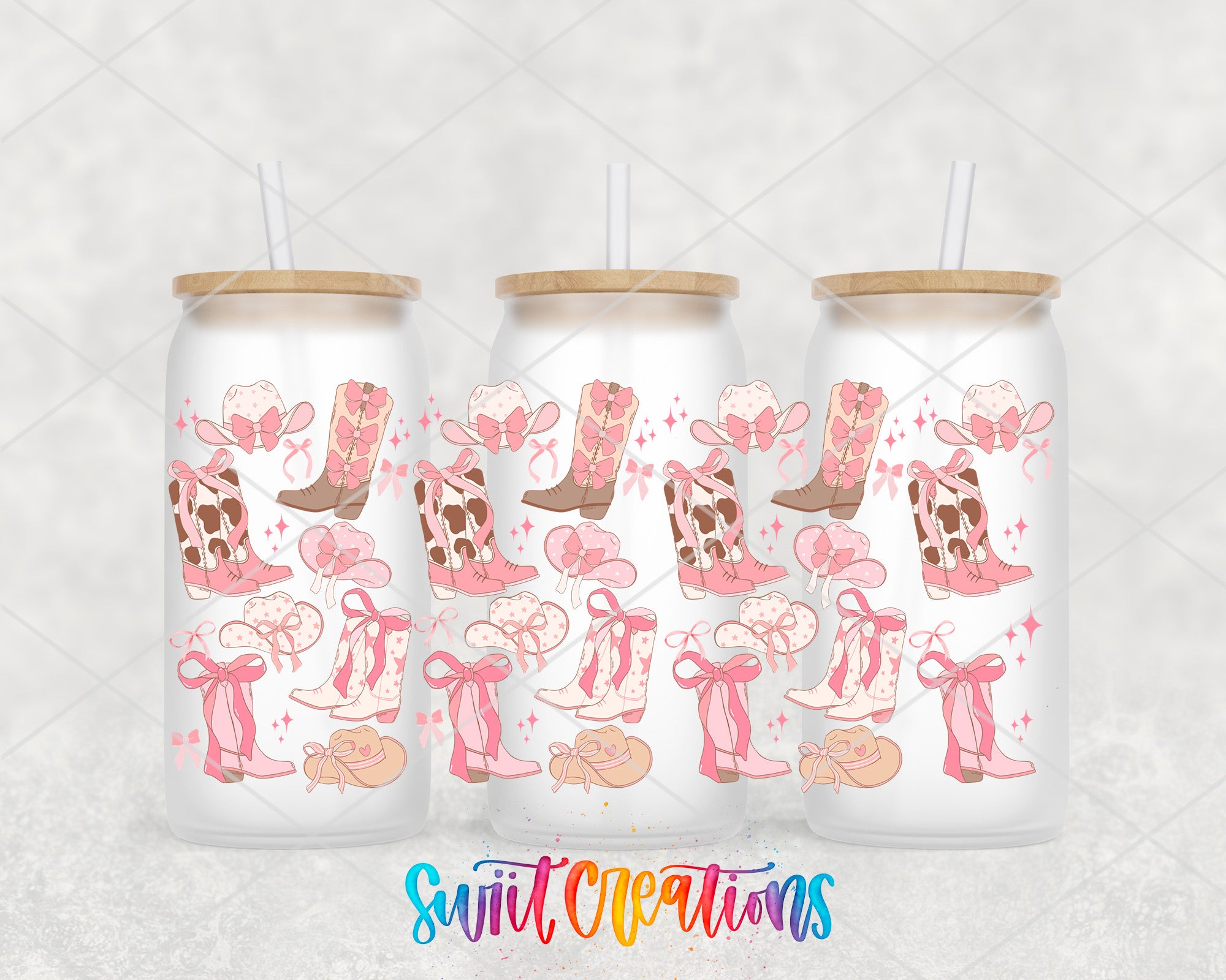 Three white tumblers with pink and brown cowgirl boots and bows on them, along with straws.