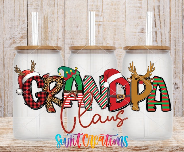 a couple of christmas mugs sitting on top of a wooden table