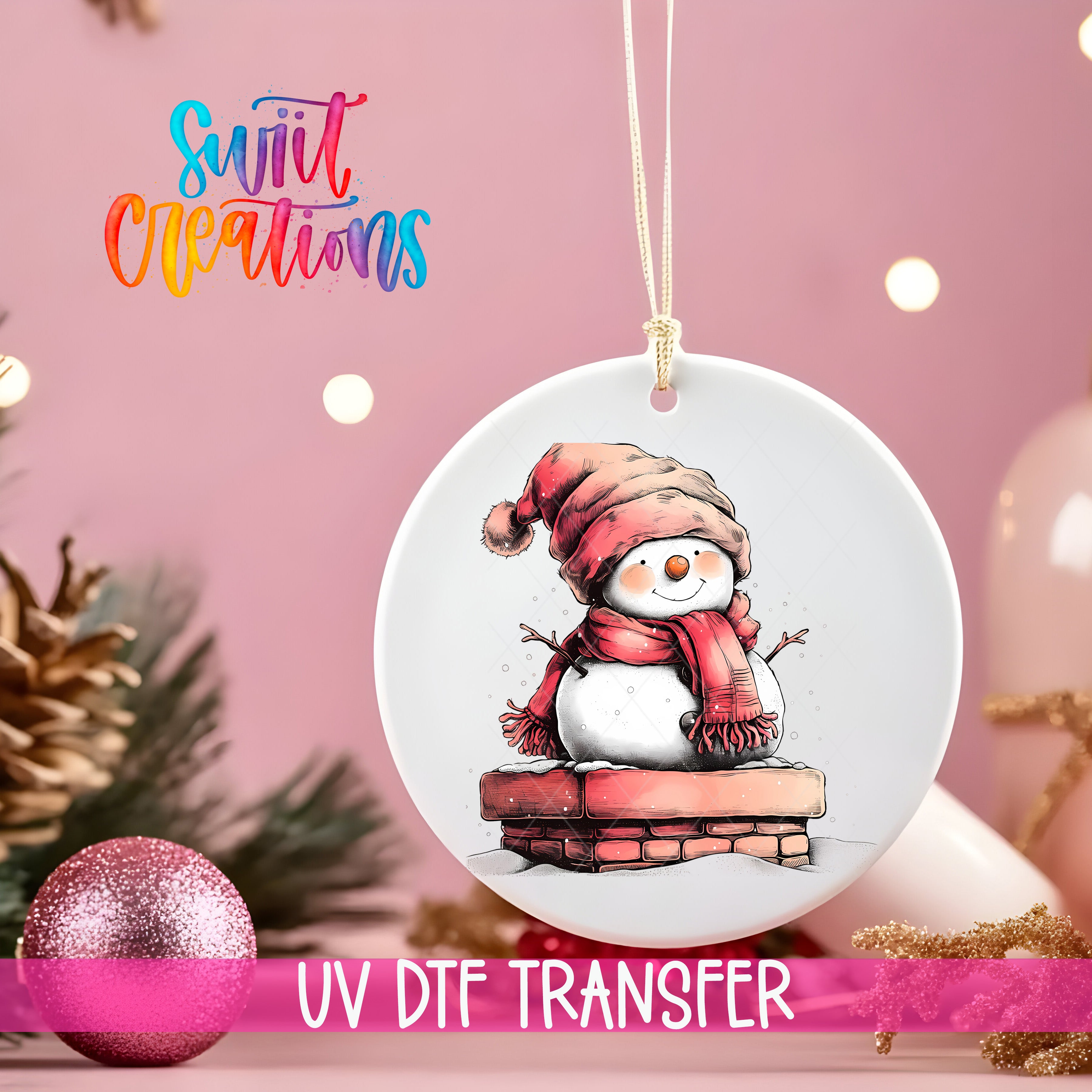 A white ornament with a snowman illustration is hanging on a string, surrounded by Christmas decorations and a pink background.