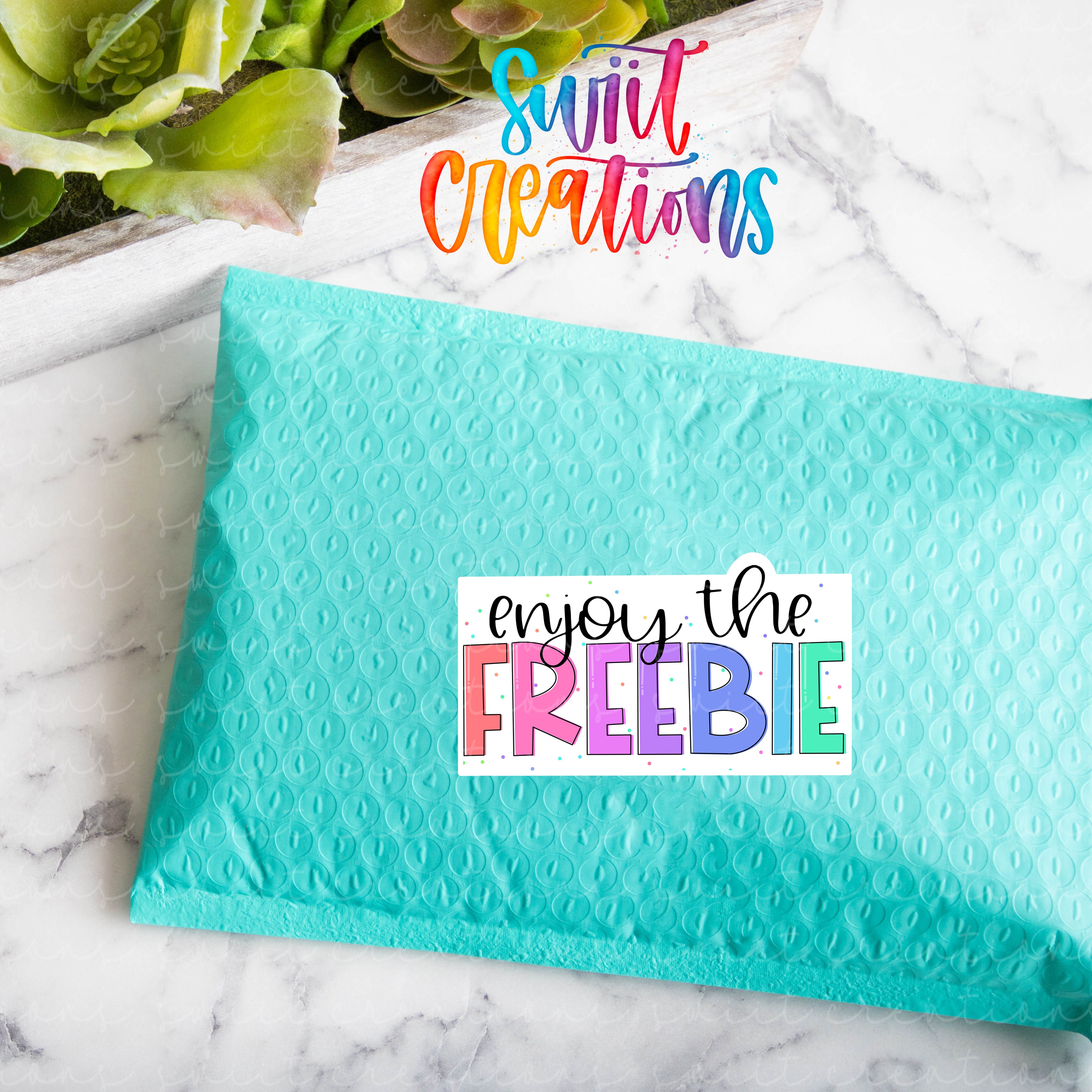 a blue envelope with the words enjoy the freebie on it