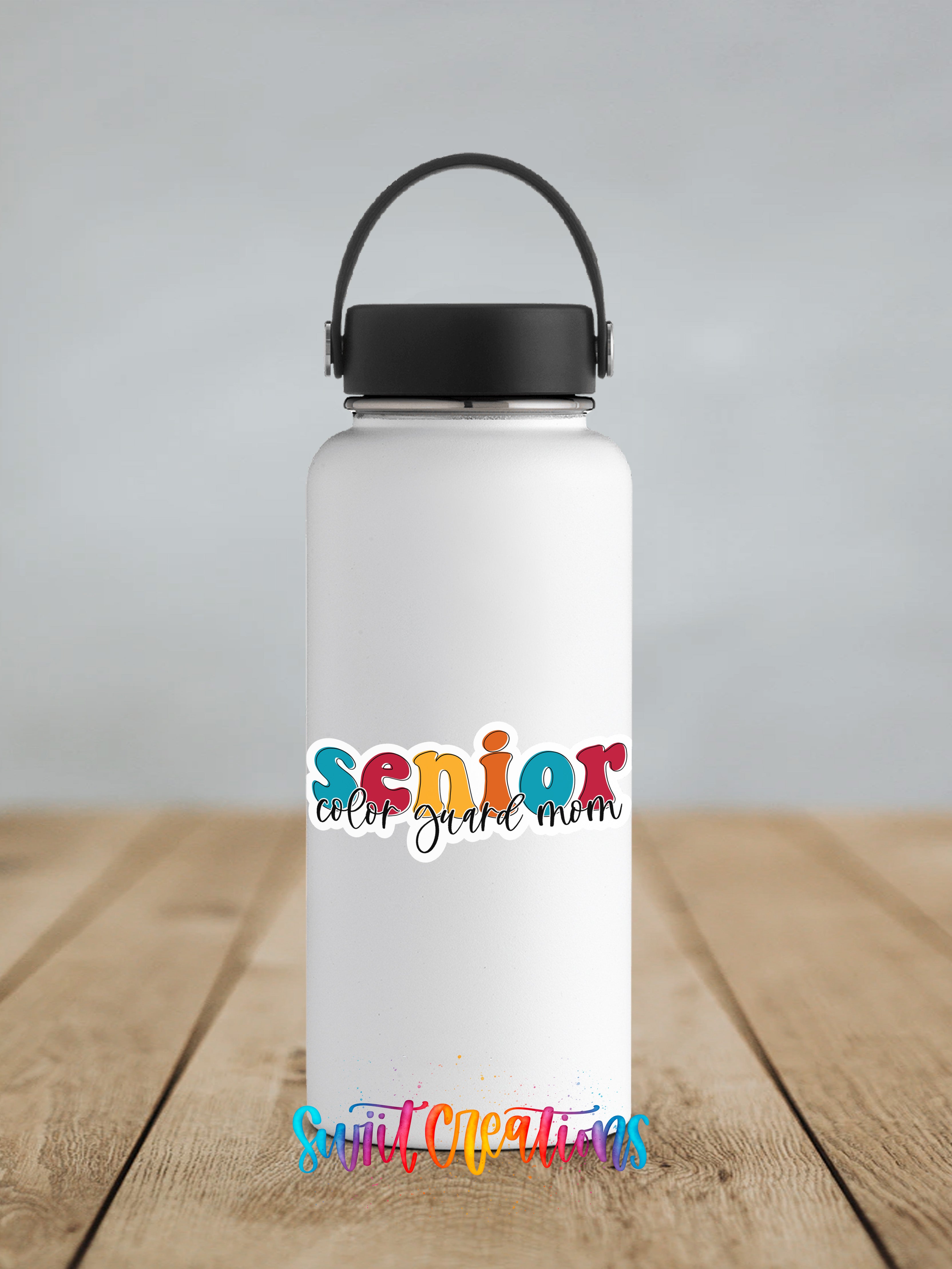 A white water bottle with a black handle and a colorful sticker that says " Senior color guard mom".