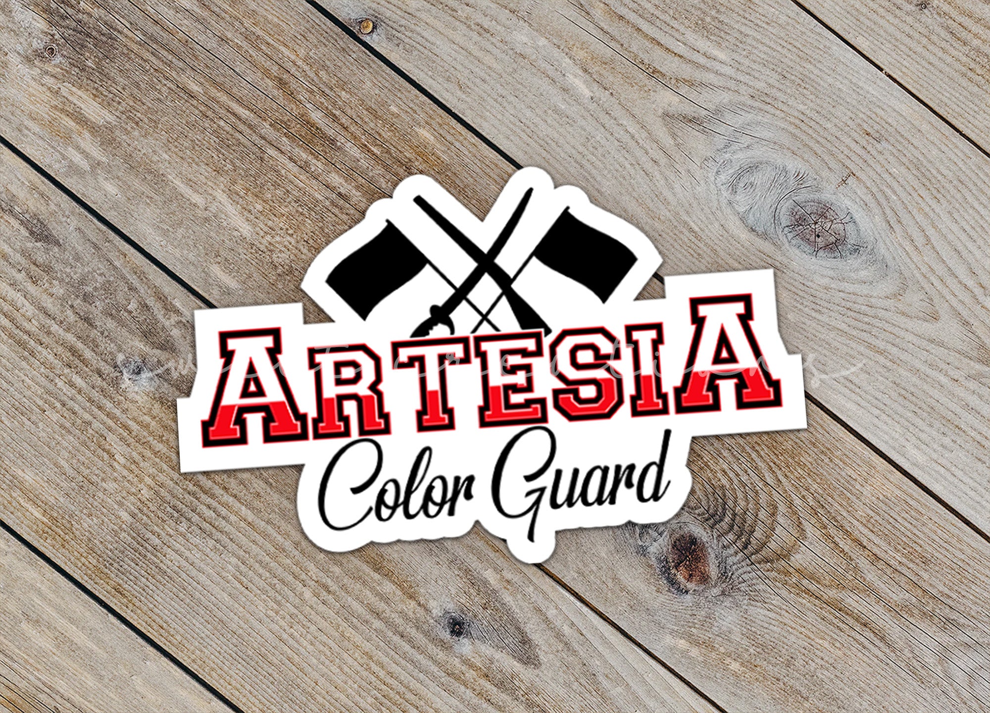 a sticker with the words artesia and two crossed axes