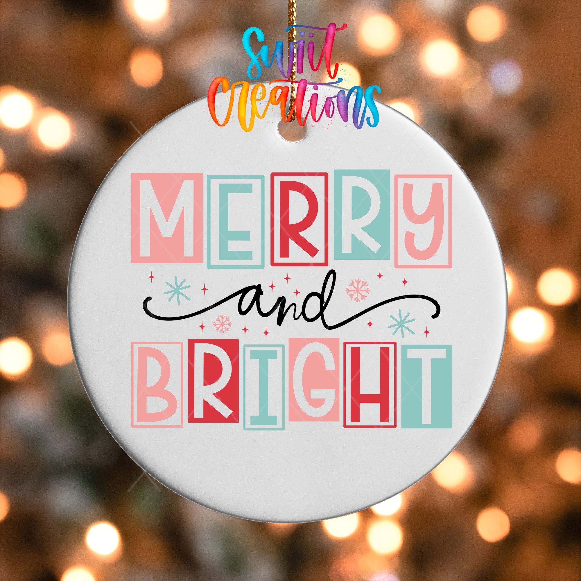 A white ceramic ornament with the text "MERRY AND BRIGHT" in a colorful, stylized font.