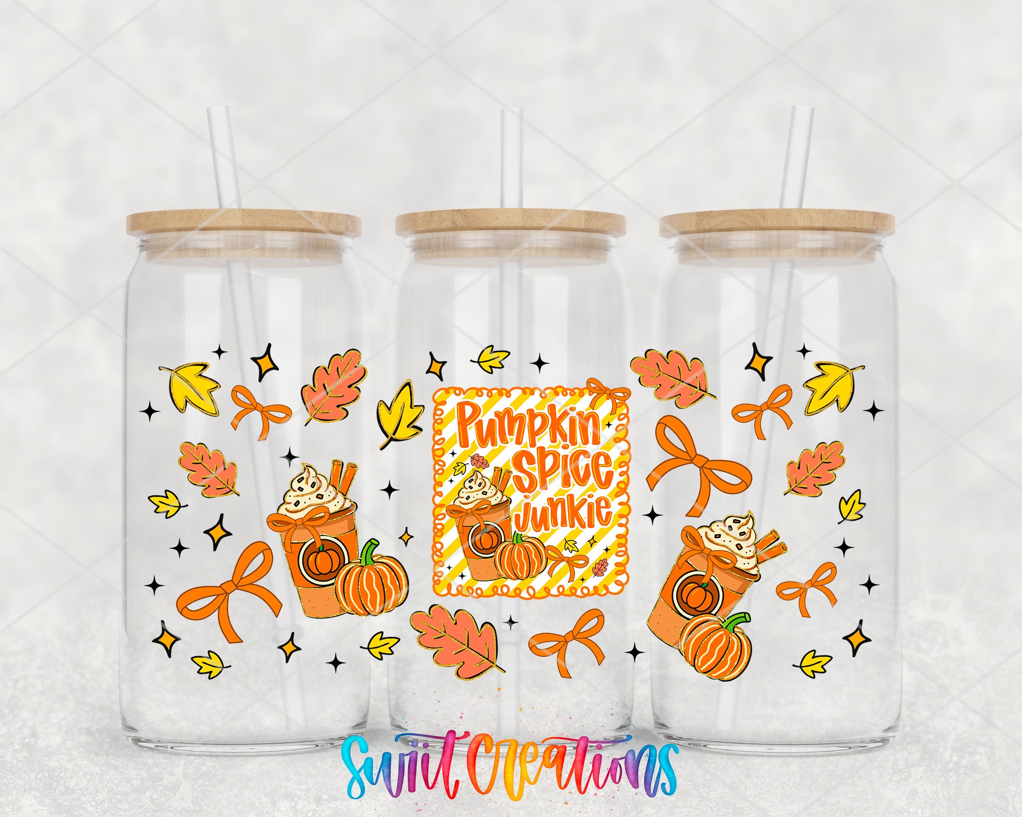 three glass tumblers with autumn-themed designs, including pumpkins, leaves, and other fall-related elements.