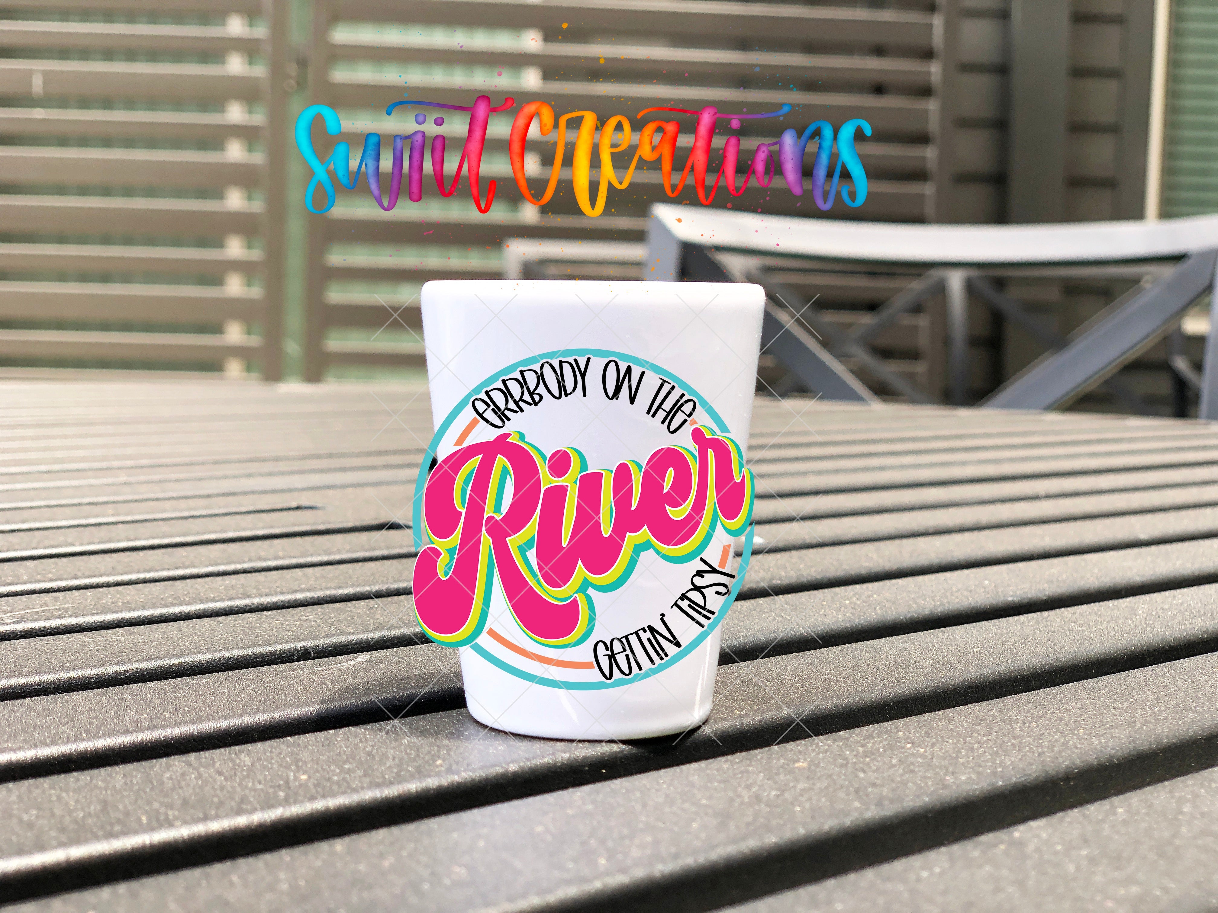 a paper cup sitting on top of a wooden table