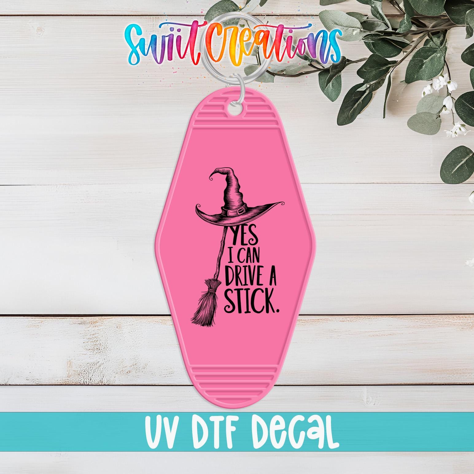 A pink keychain with a witch's hat and the text "YES I CAN DRIVE A STICK" printed on it, along with the text "UV Dtf Decal" at the bottom.