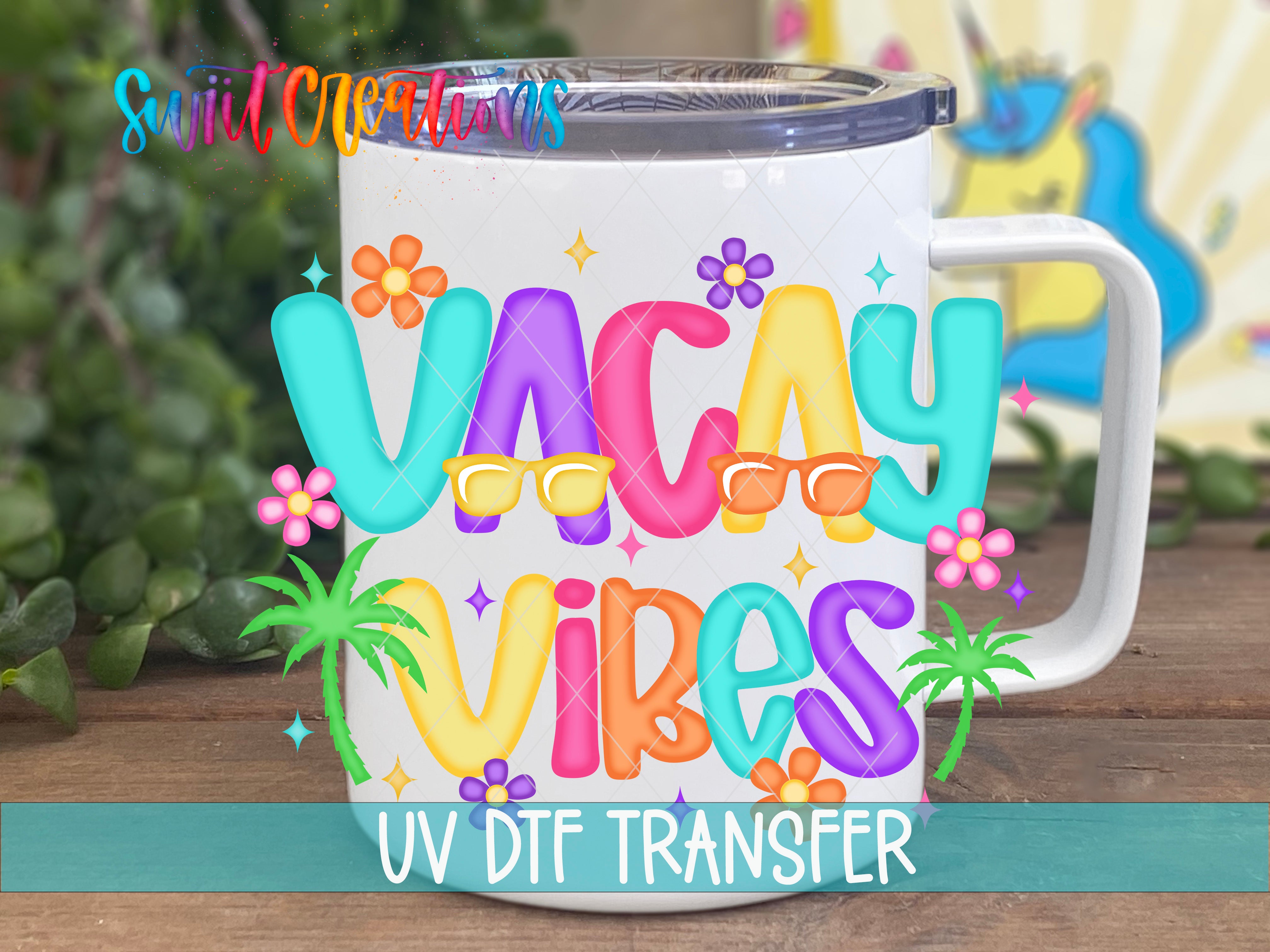 A colorful mug with the text "VACAY VIBES" printed on it, surrounded by various tropical elements such as flowers, palm trees, and stars.