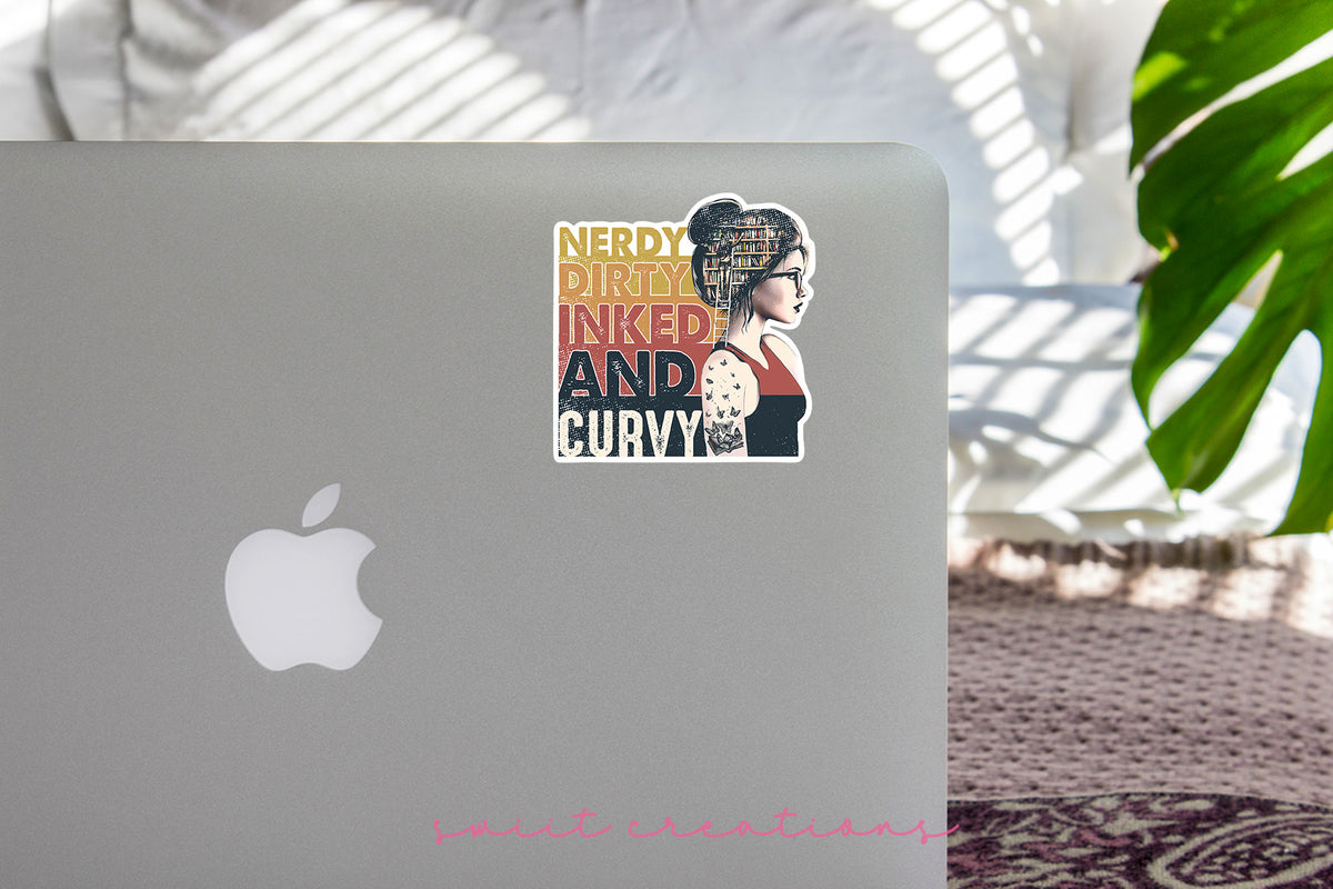 Nerdy Dirty Inked and Curvy sticker on the lid of a silver laptop