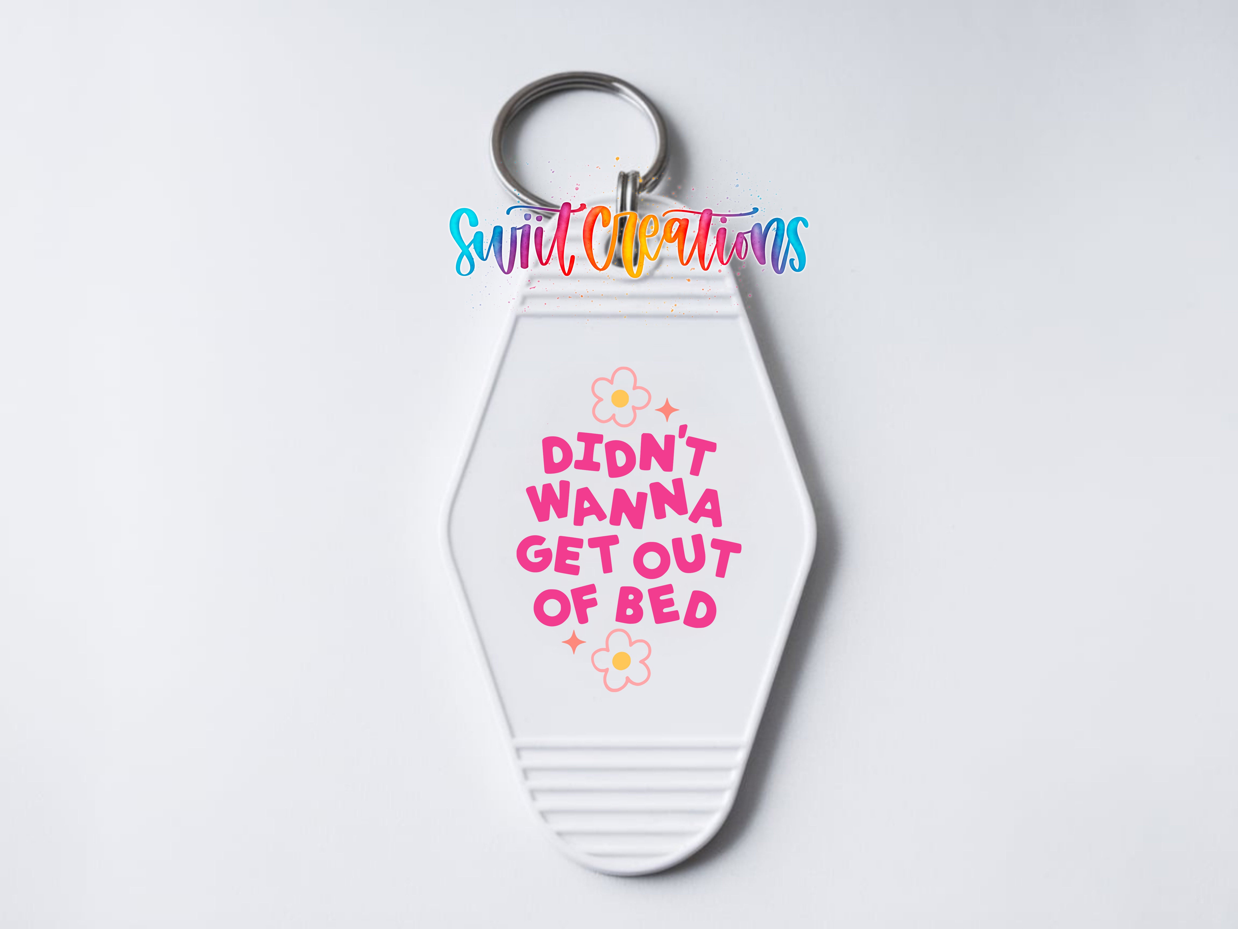 A keychain with a keyring and a message printed on it.