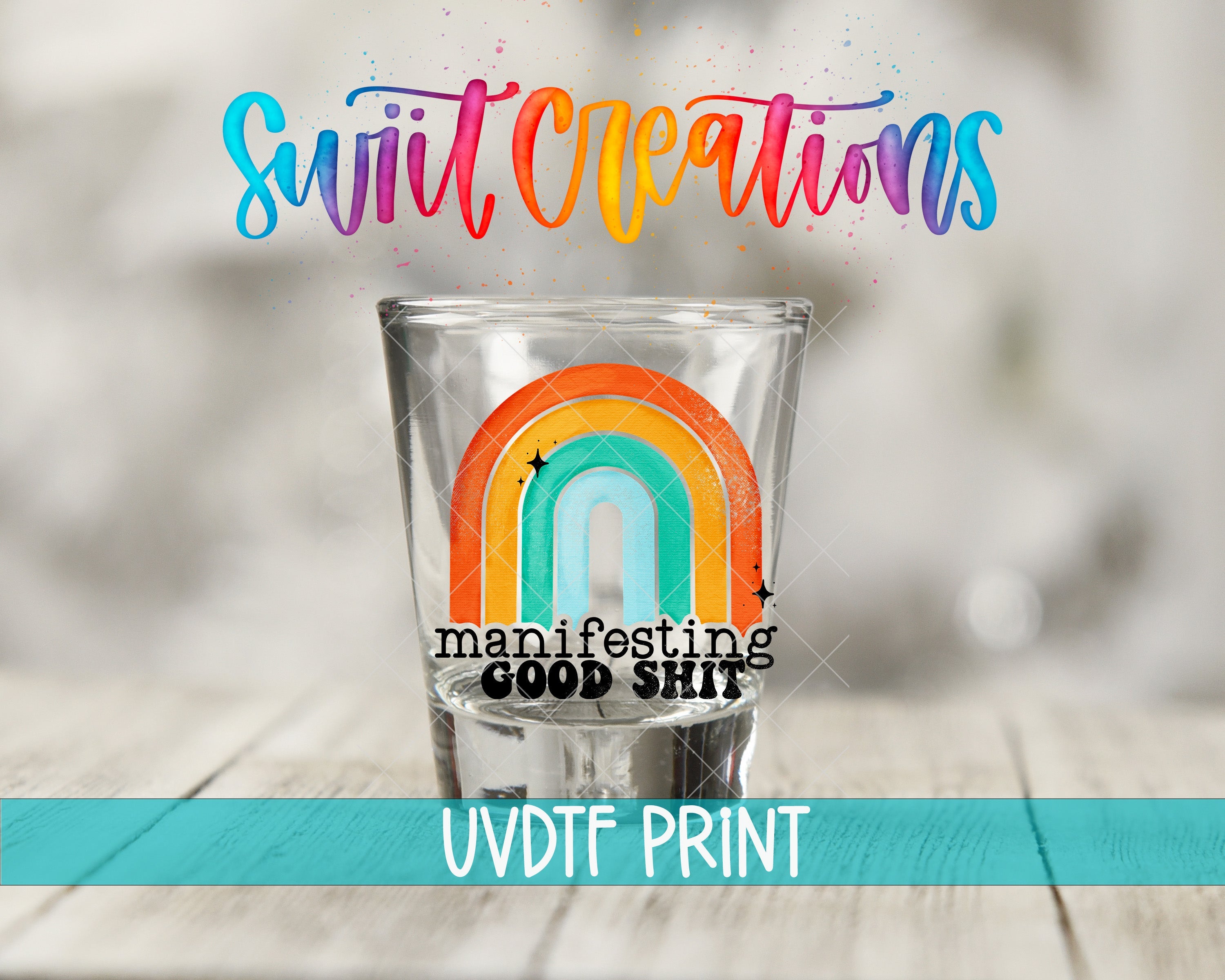 a shot glass with a rainbow painted on it