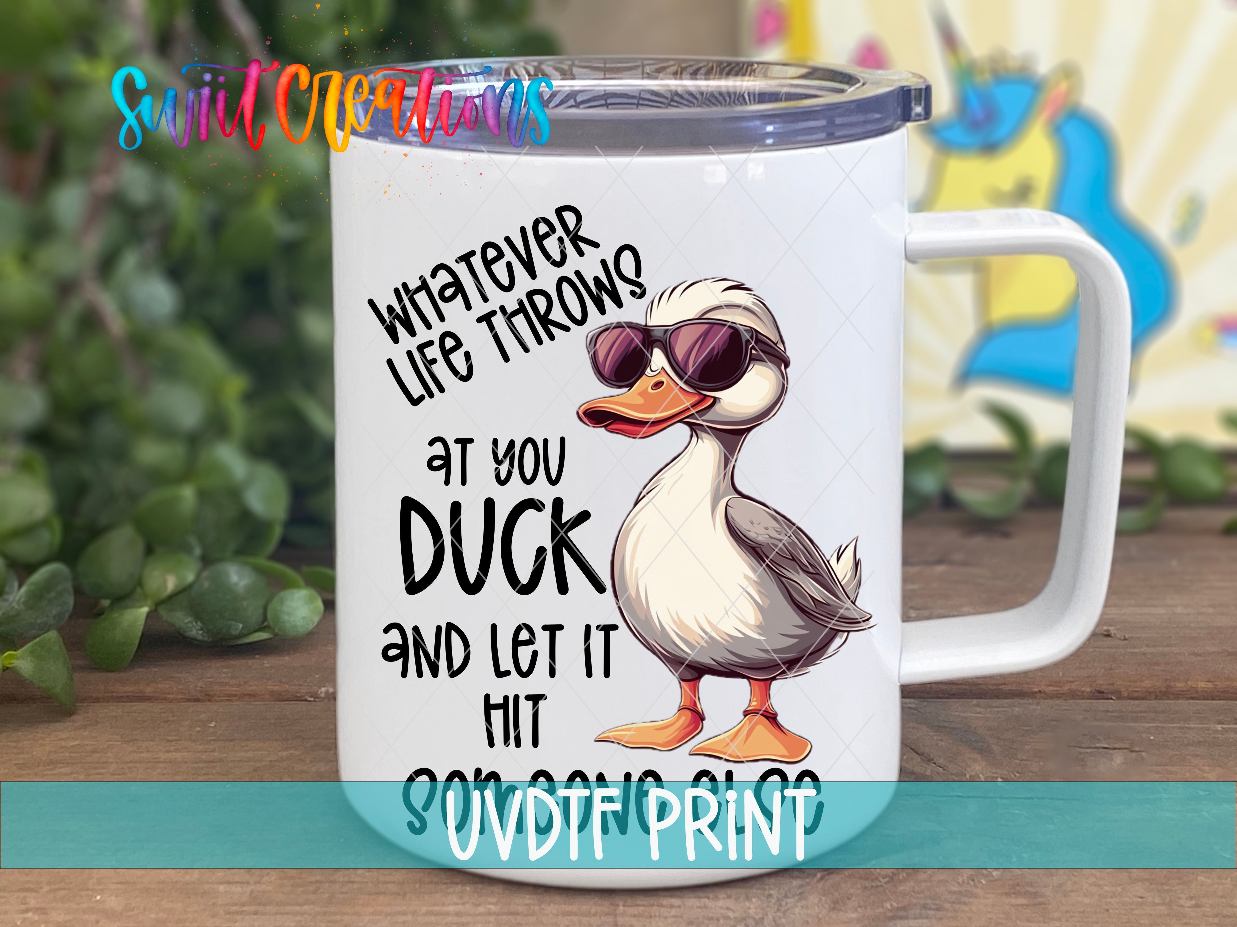 a white coffee mug with a duck wearing sunglasses