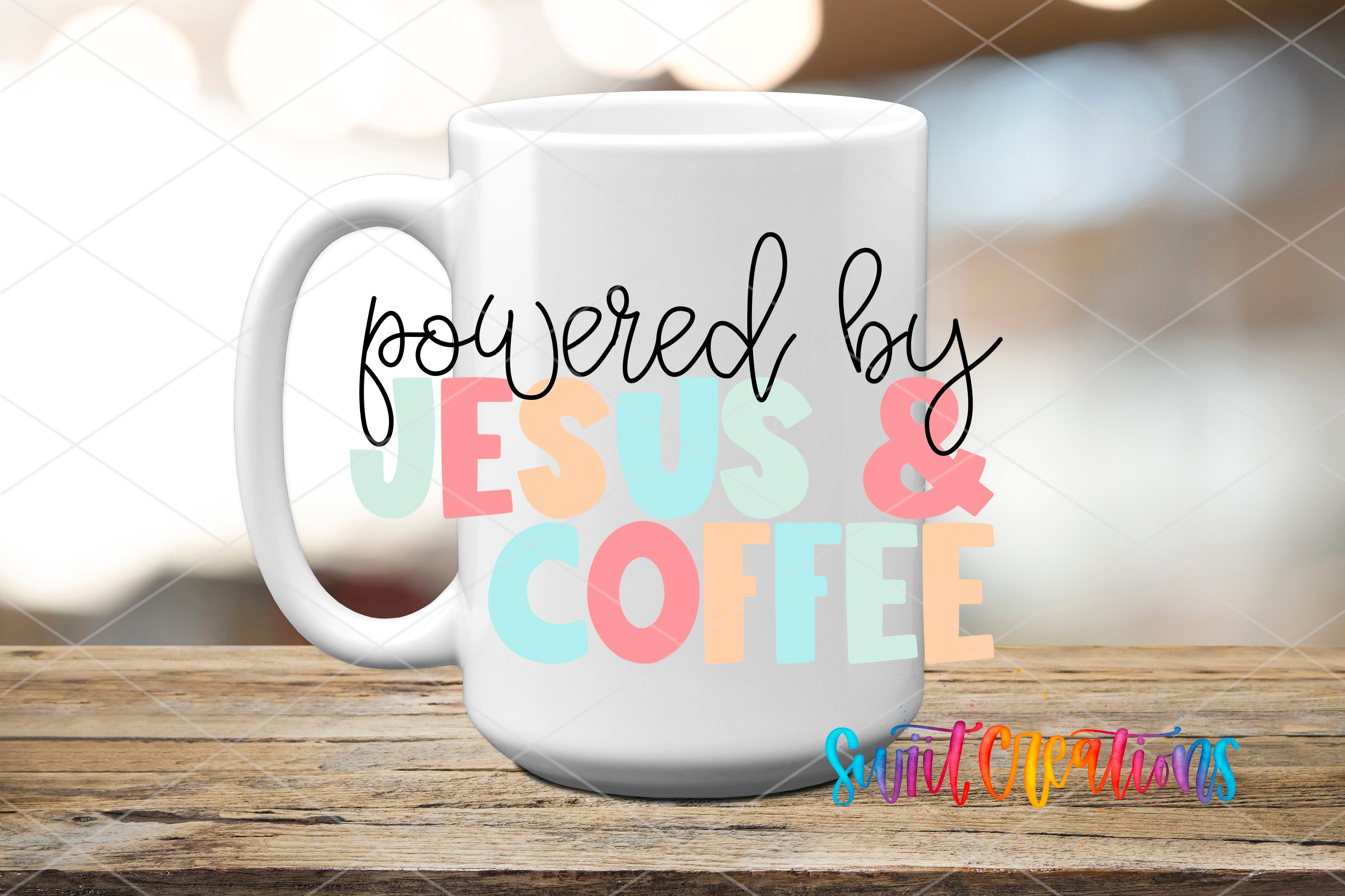 A white coffee mug with the text "powered by JESUS & COFFEE" printed on it, placed on a wooden surface.