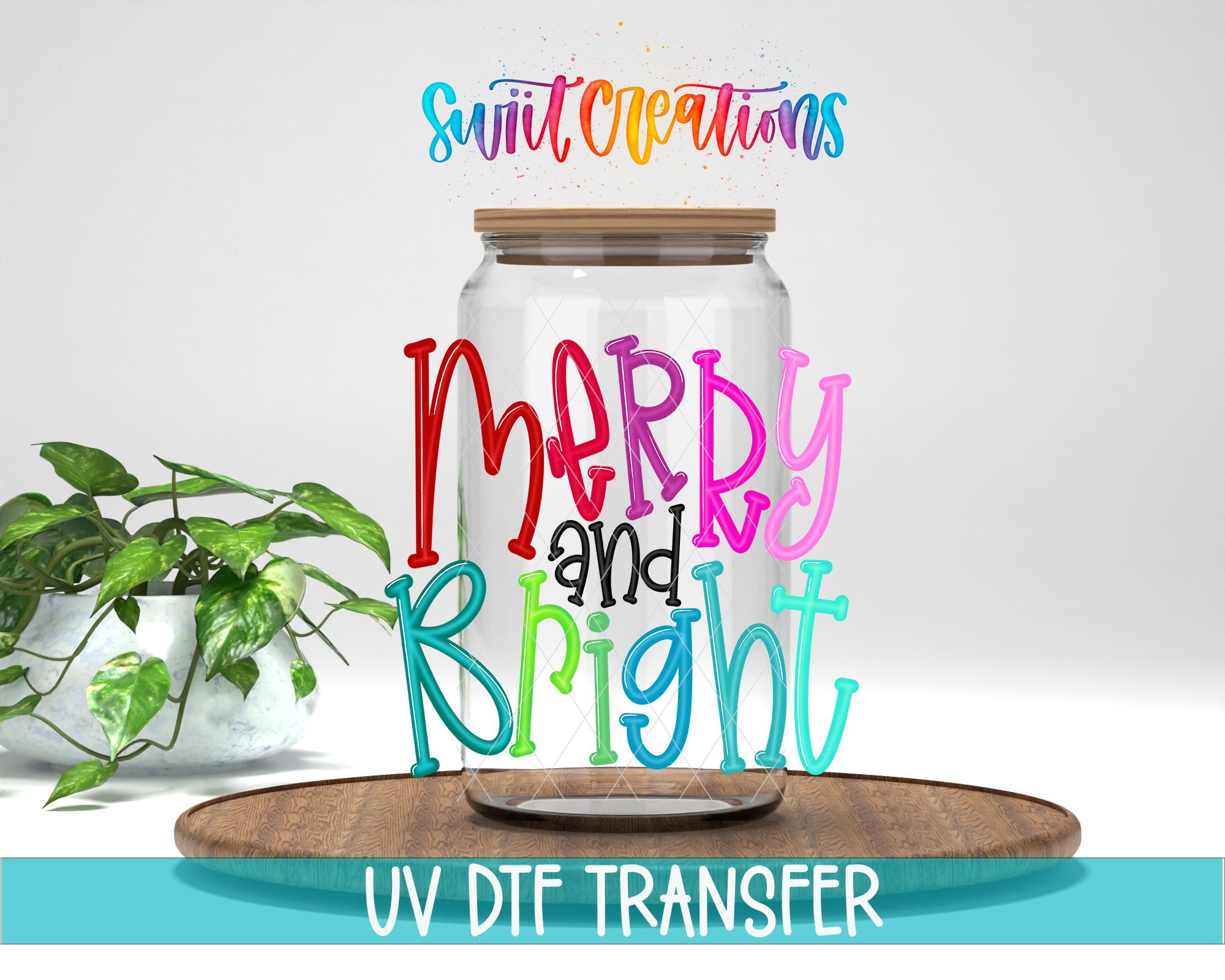 a clear glass jar with colorful text on it, placed on a wooden surface. There is a potted plant in the background, and the image includes text that says "Swift Creations Merry and Bright" and "UV DFT Transfer".