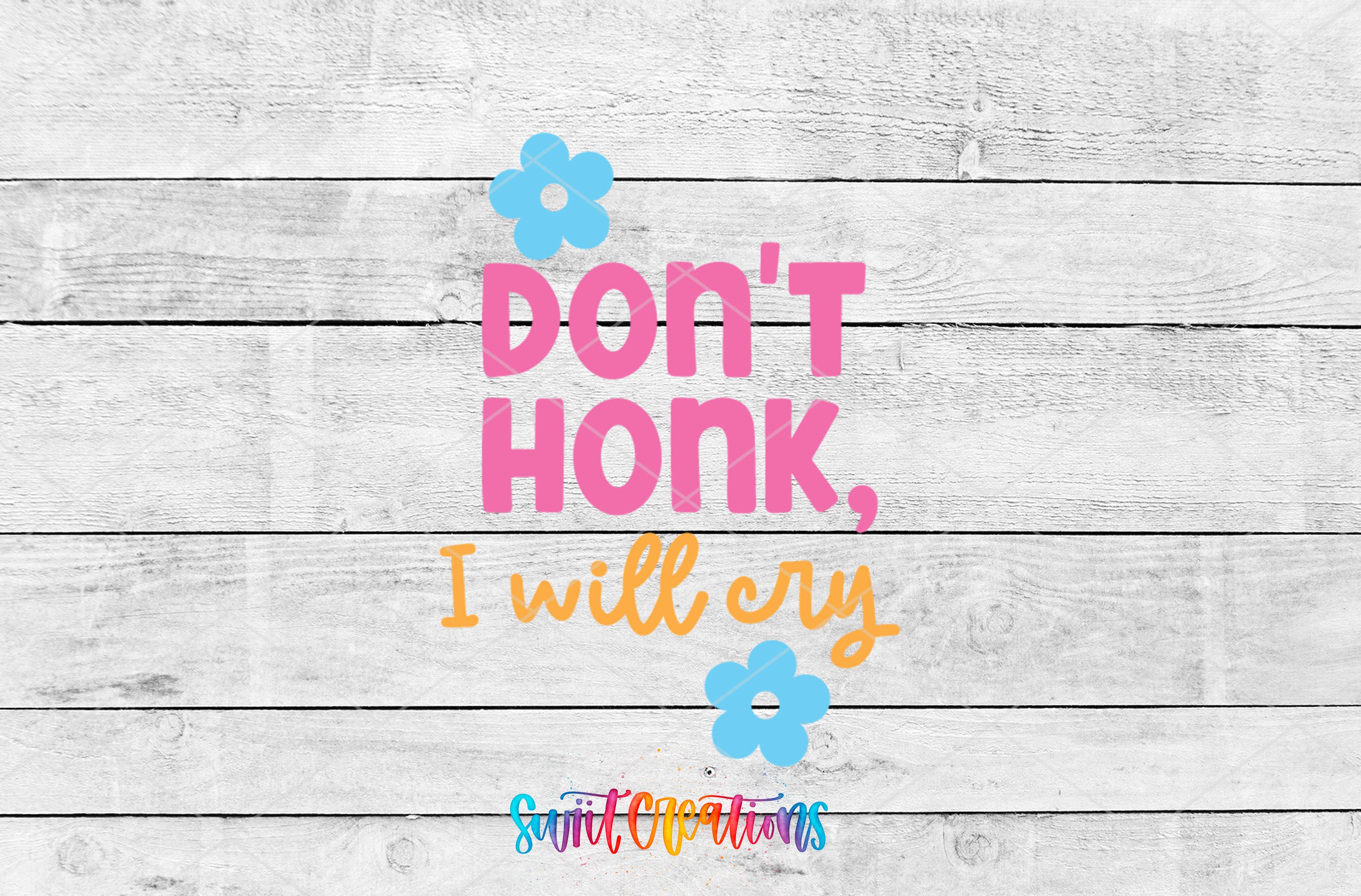a text overlay on a white wooden background that reads "DON'T HONK, I WILL CRY" with two blue flowers positioned above the text.