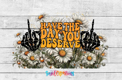 Have the Day You Deserve skeleton hands and daisies UV DTF wrap artwork on a white wood background