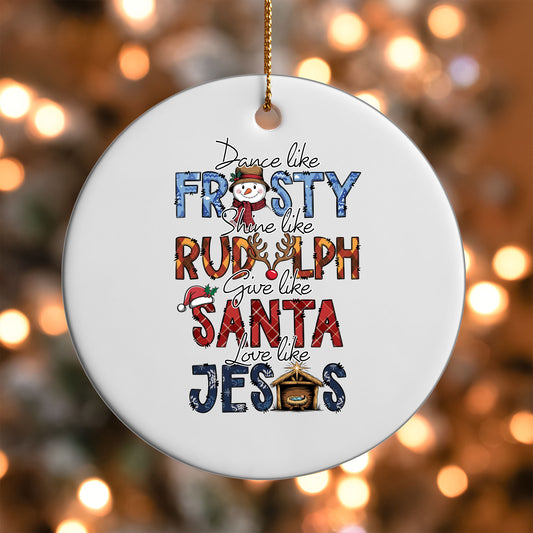 Dance Like Frosty Love Like Jesus ornament UV DTF transfer on a round white ornament with a bokeh light background
