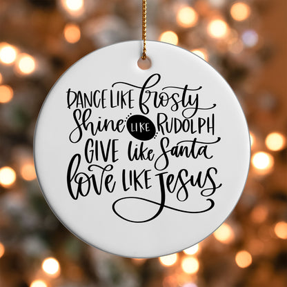 Dance Shine Give Love ornament UV DTF transfer on a round white ornament with a bokeh light background