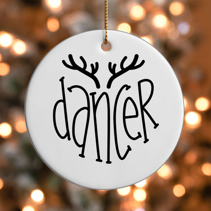 Dancer Reindeer Name ornament UV DTF transfer on a round white ornament with a bokeh light background