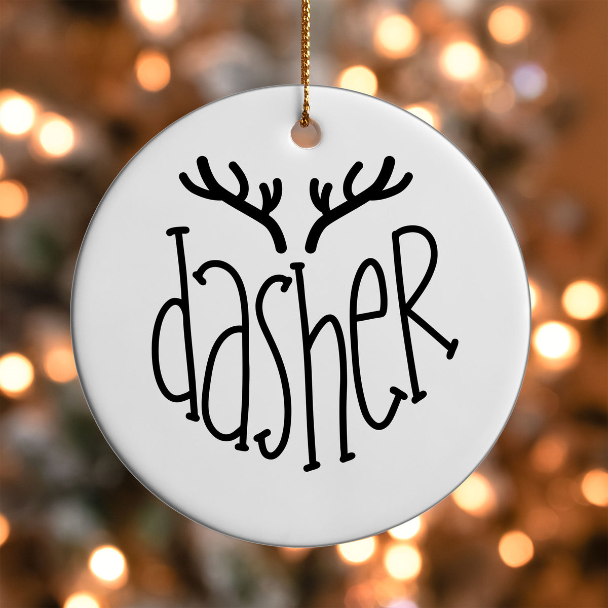 Dasher Reindeer Name ornament UV DTF transfer on a round white ornament with a bokeh light background