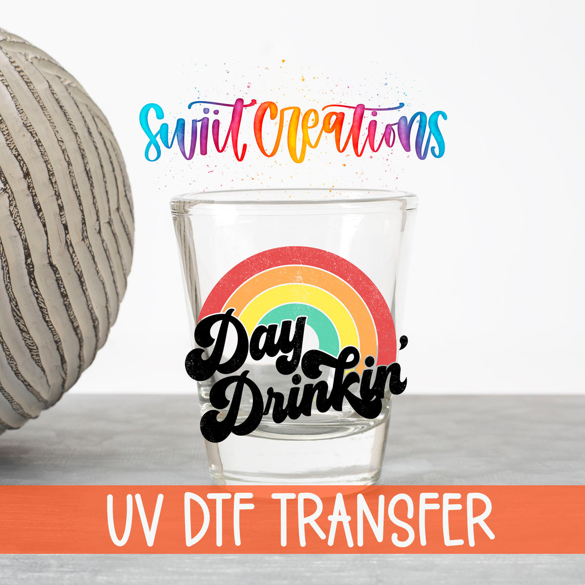 Day Drinkin' UV DTF transfer on a clear shot glass with the Swiit Creations logo and UV DTF Transfer banner
