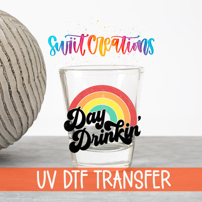 Day Drinkin' UV DTF transfer on a clear shot glass with the Swiit Creations logo and UV DTF Transfer banner