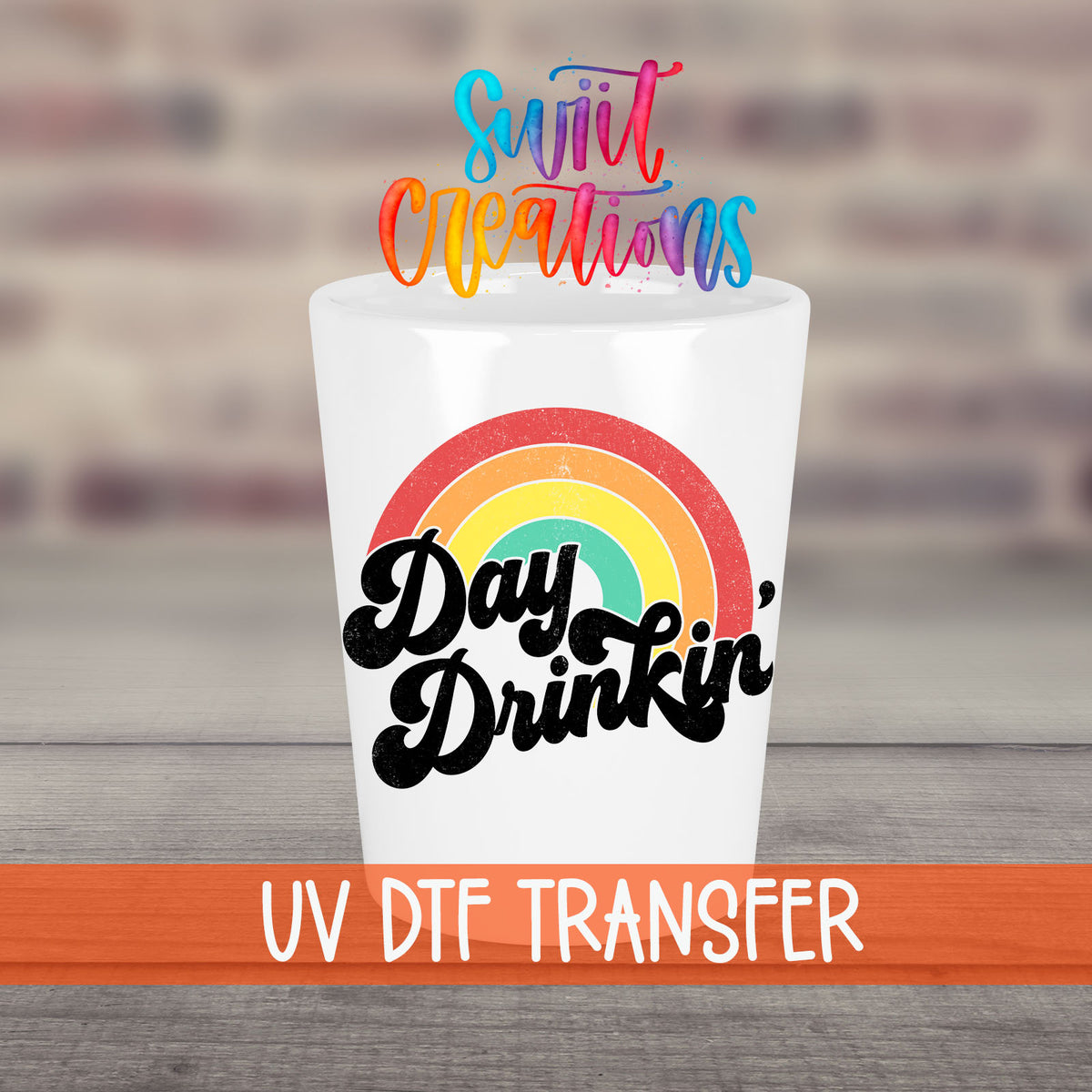 Day Drinkin' UV DTF transfer on a white shot glass in front of a brick wall