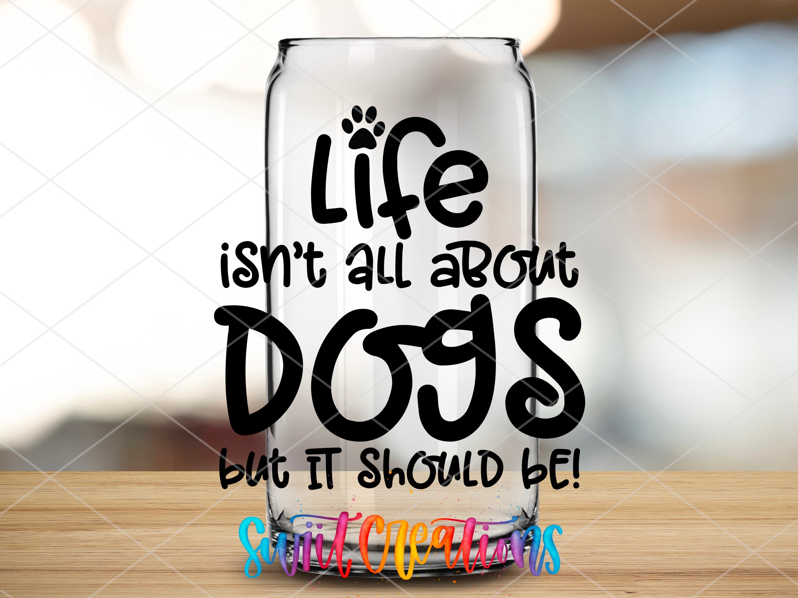 a glass with the words life isn't all about dogs but it should be