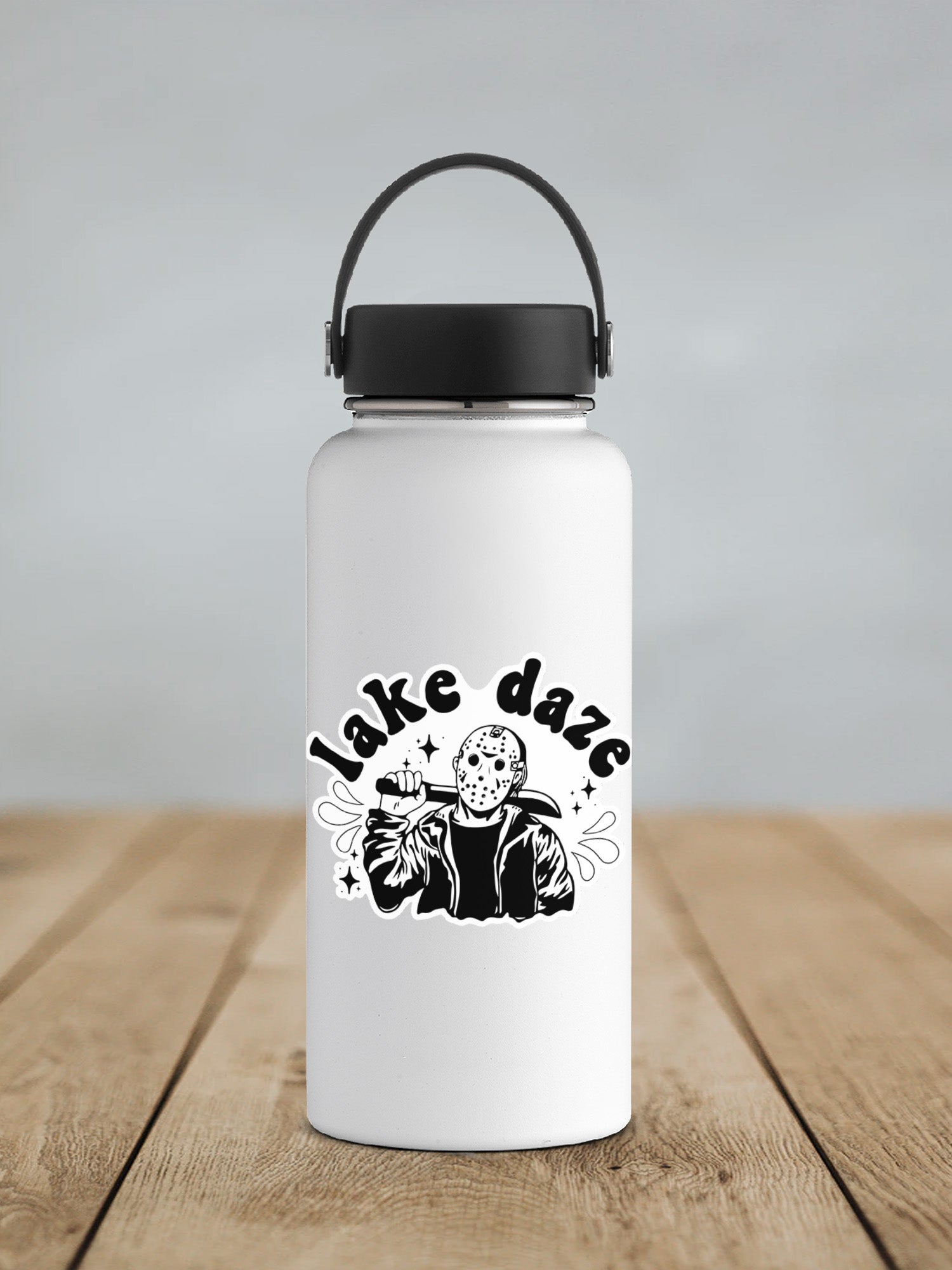 a white water bottle sitting on top of a wooden table