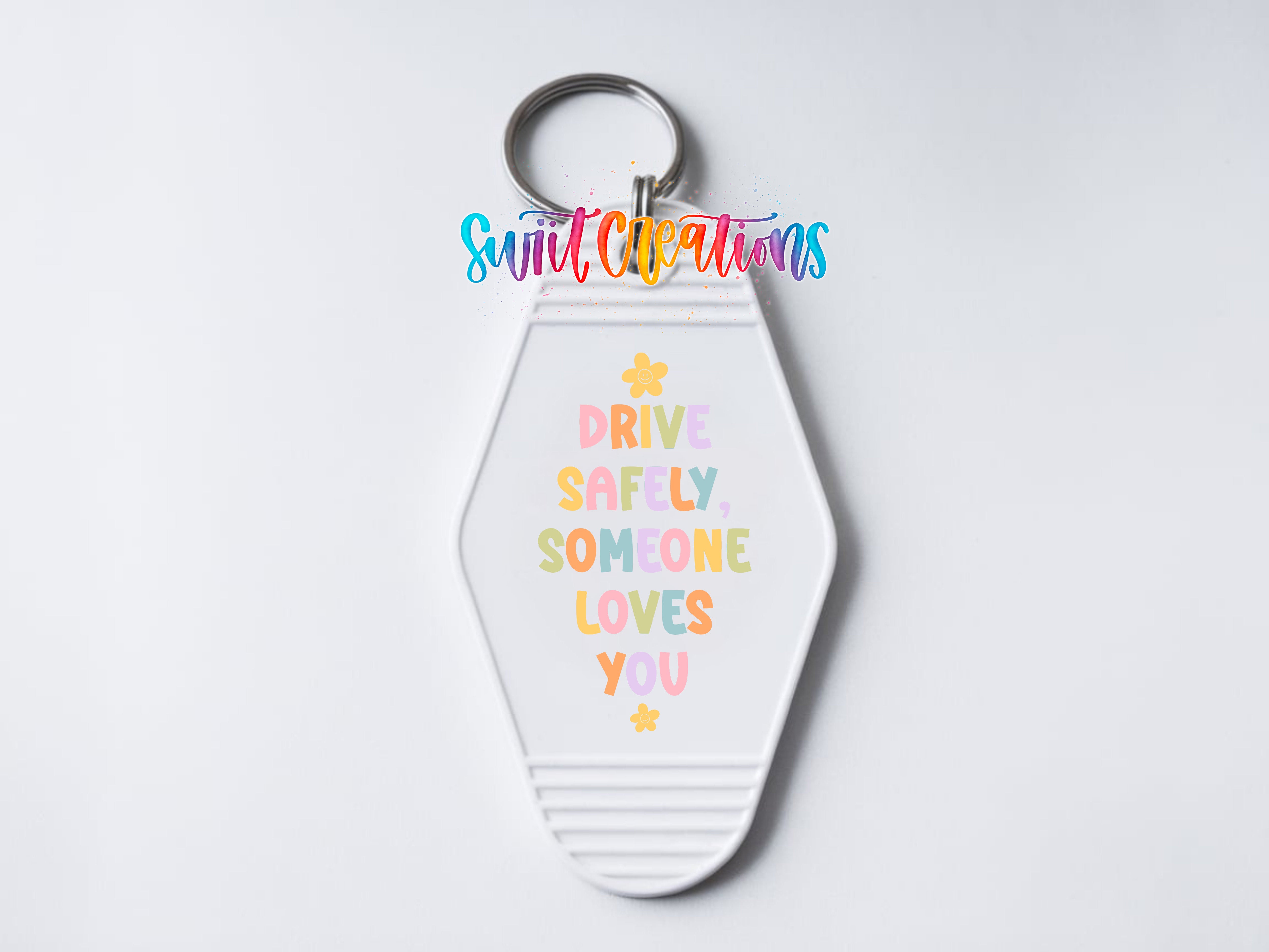 A keychain with a message about driving safely and loving someone.