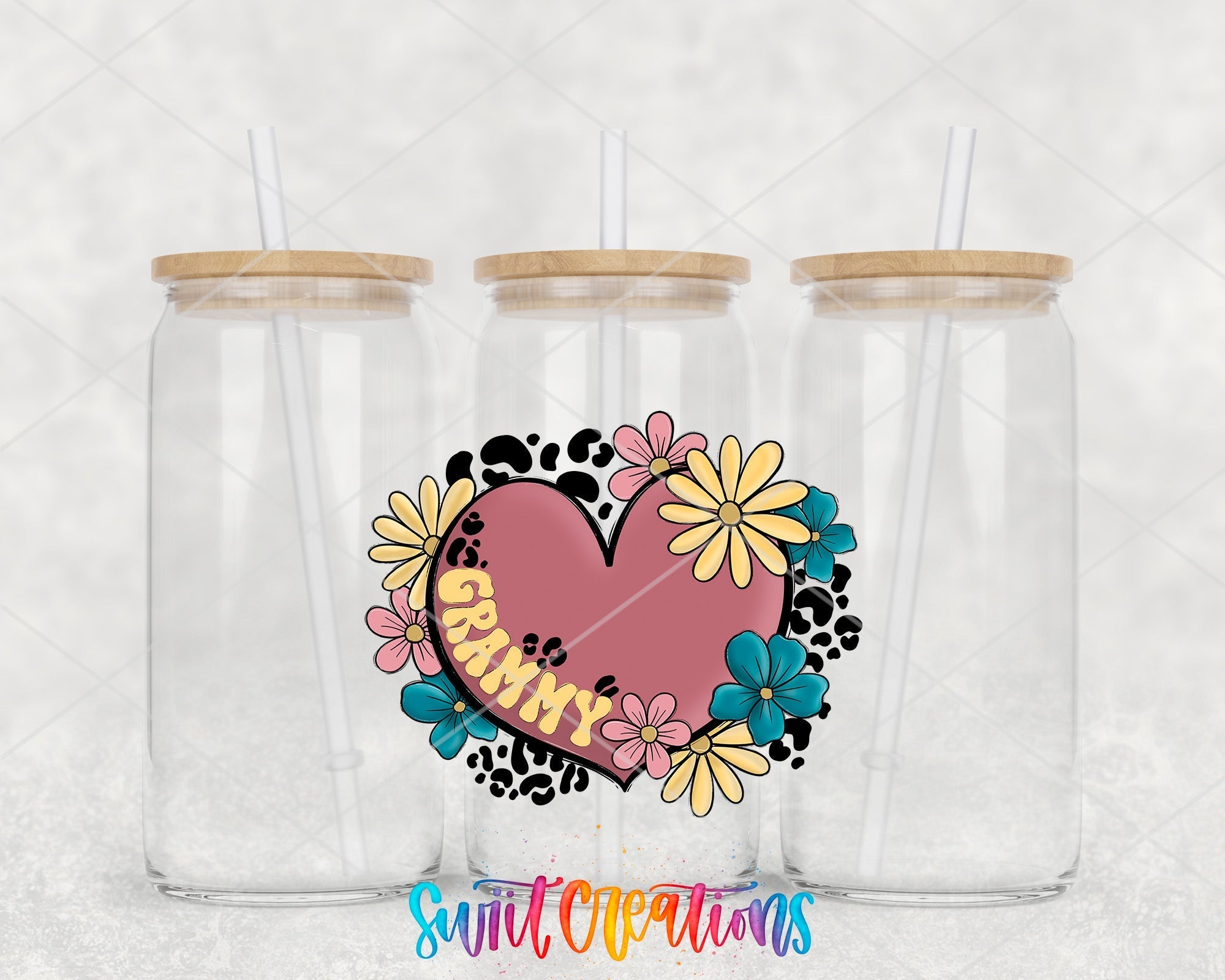 two clear tumblers with a heart and flowers on them