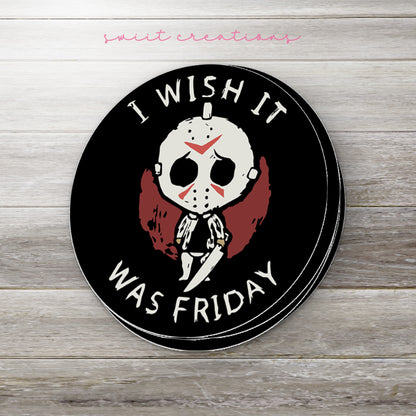 Stack of I Wish It Was Friday glossy stickers on a gray wood table