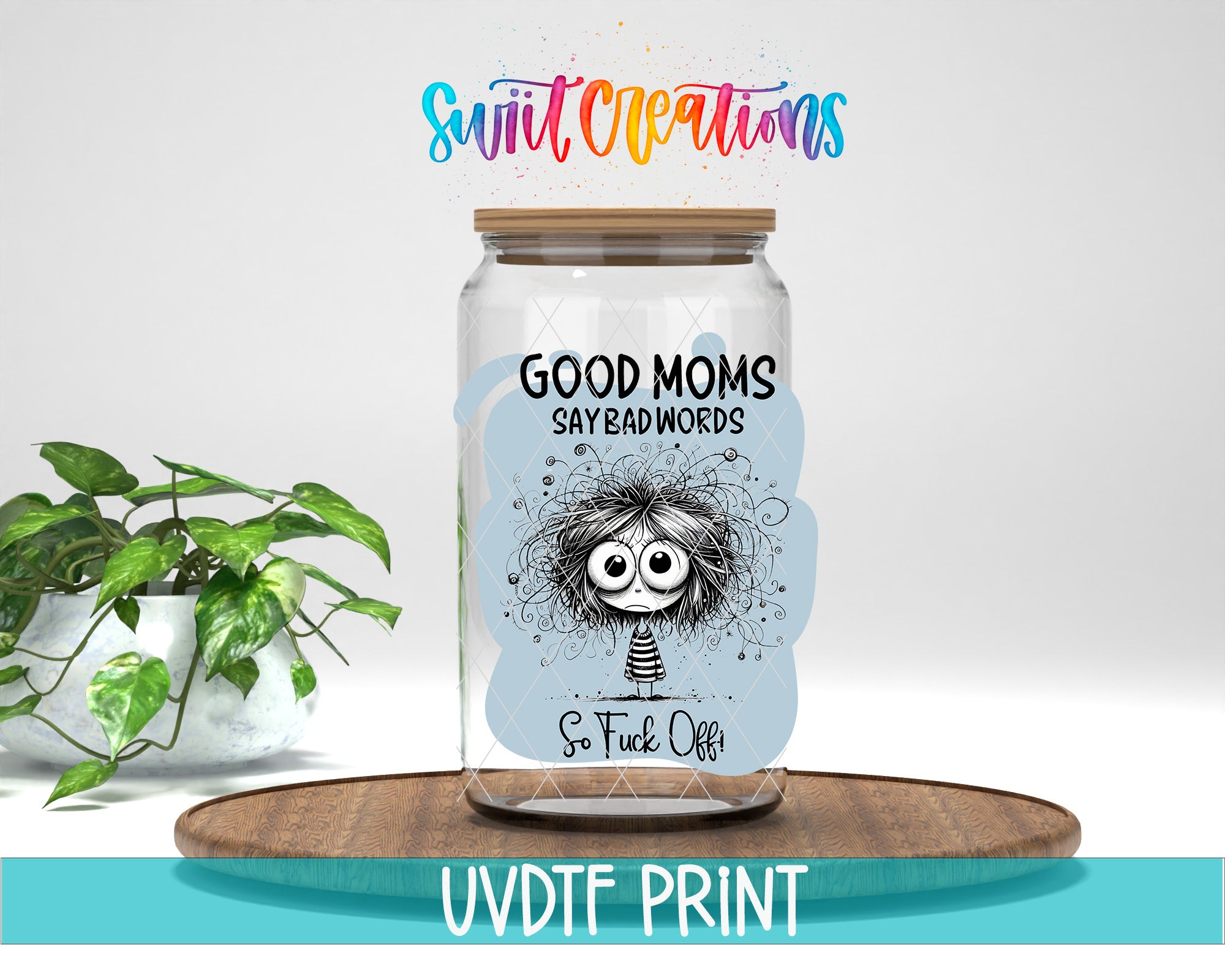 A jar with a label that says "GOOD MOMS SAYBADWORDS So FUCK Off" and features a cartoon character. The jar is placed on a wooden surface, and there is a potted plant in the background.