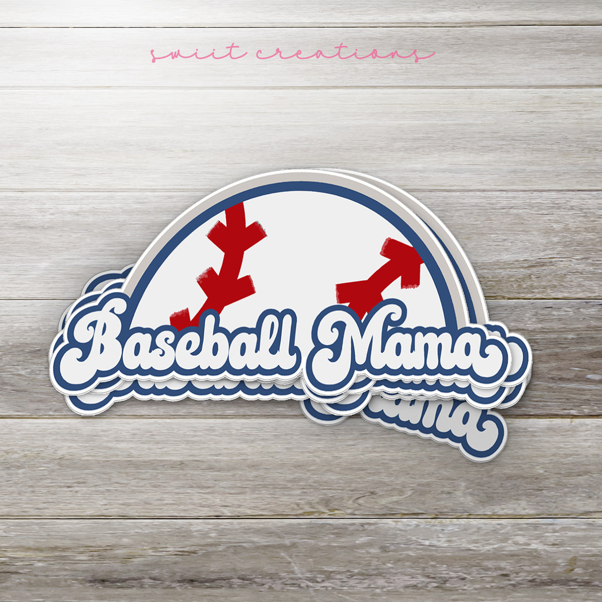 Stack of Baseball Mama glossy stickers on a gray wood table